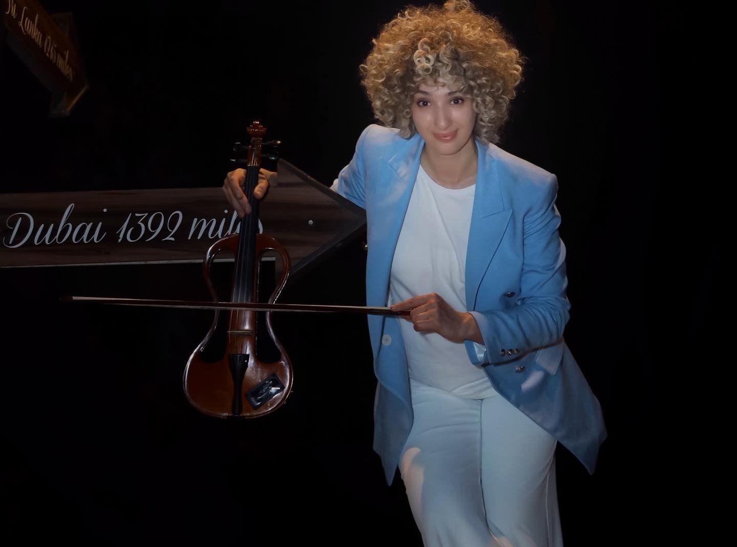 Madina performing on electric violin